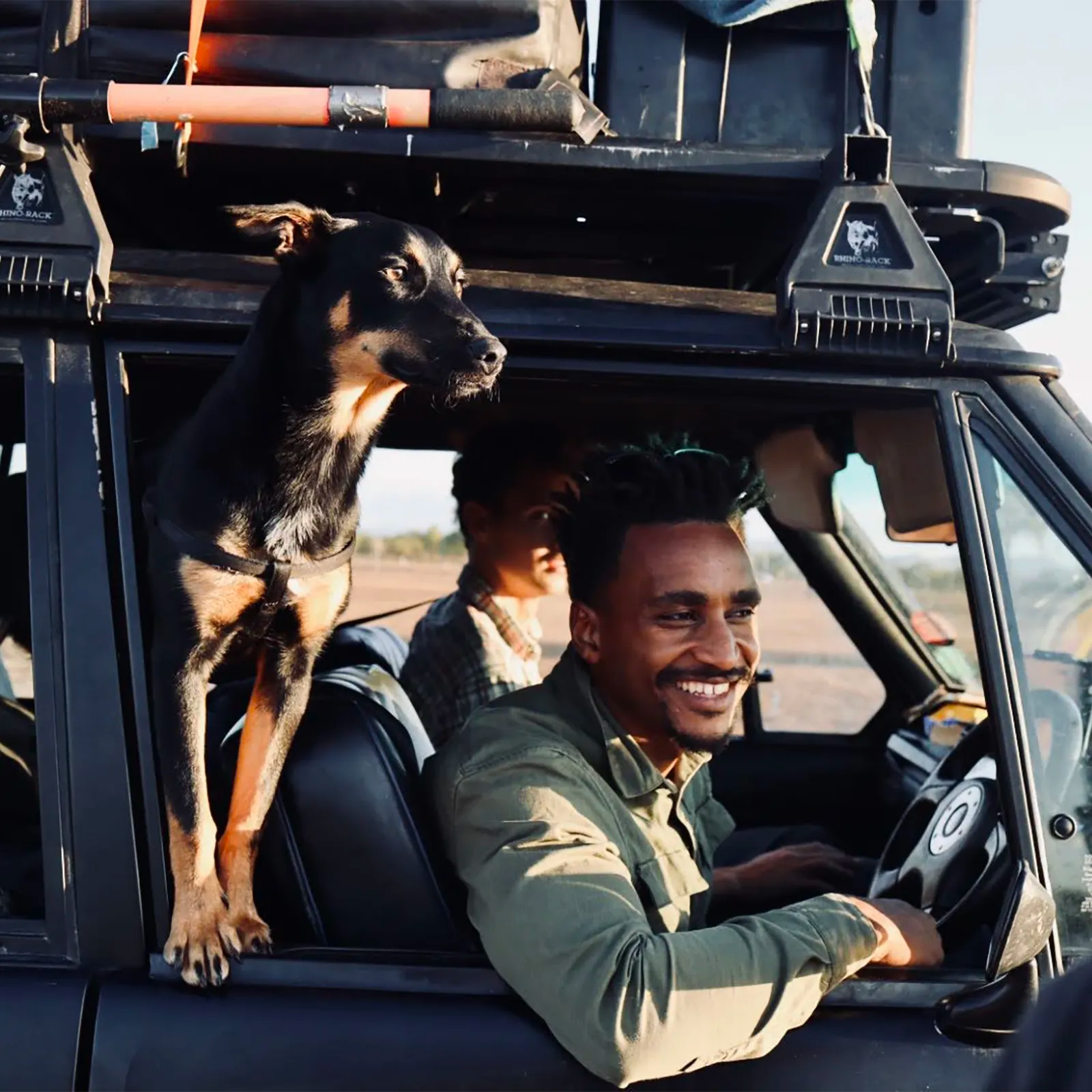 Endak driving Range Rover Classic with Zila riding shot gun out the window | Range Rover Adventures | Range Rover Classic | Range Rover Restoration | Range Rove Build | Overlanding Range Rover Classic | Touring Range Rover Classsic