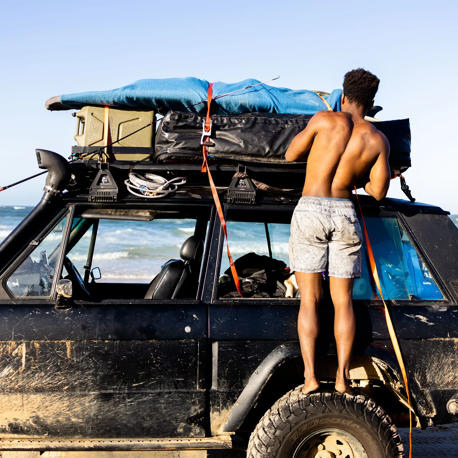 Endak tying down surfboards on 2 door Range Rover Classic | Range Rover Adventures | Range Rover Classic | Range Rover Restoration | Range Rove Build | Overlanding Range Rover Classic | Touring Range Rover Classsic